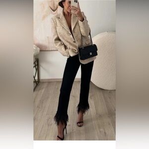 ZARA High waist jeans with belt loops.5 pockets. Removable tonal feathers at hem